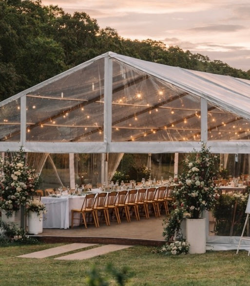 Outdoor wedding reception with clear tent, string lights, and floral decorations.Adelaide hills and Winery wet weather plan. Outdoor Wedding Venues.